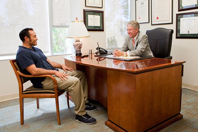 Dr. Boyd talking with patient