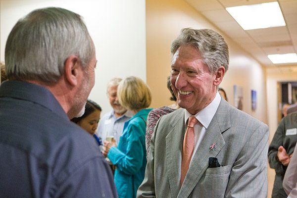 Brian J. Boyd, MD talking to a guest