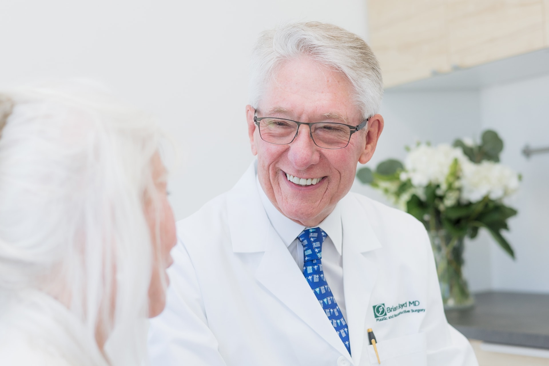 Dr. Boyd with a patient for a face consultation
