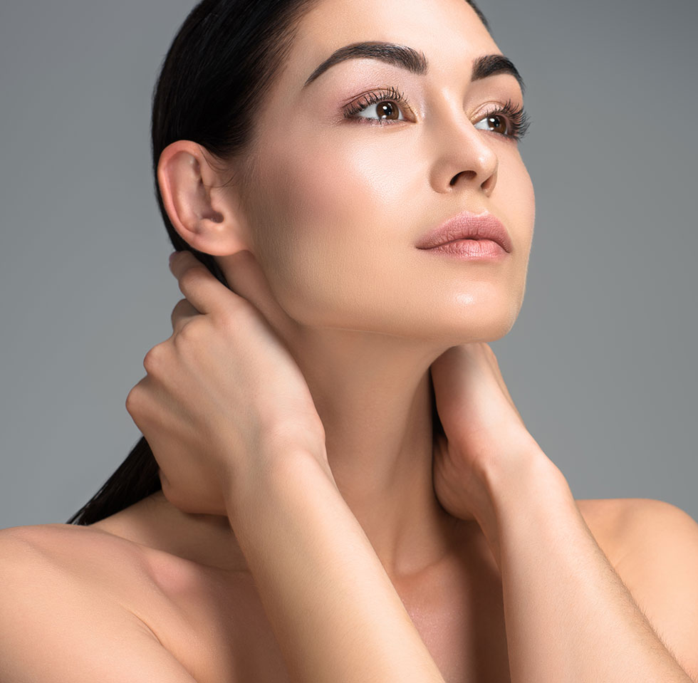 Mature woman touching her neck