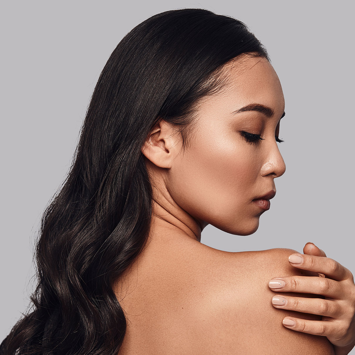 Young Woman touching her shoulder