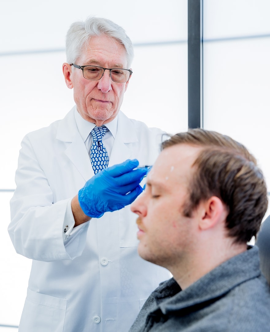 Dr. Boyd with a male patient for a facial injectable treatment
